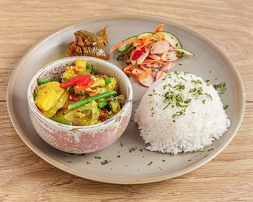 Avial
South Indian stir fried veg. Potatoes, carrots, green beans, and peas stir fried in a ginger, shallot, and coconut paste. Served with rice, pickle, and salad.

Vegan - Gluten Free
 at Dapur Malaysia in Leeds