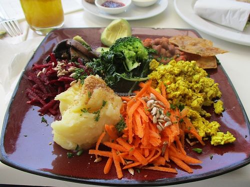 Full English Breakfast with mashed sweet potato, scrambled tofu, vacon and veggies. at The Greenside Cafe in Johannesburg