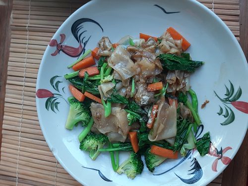 flat rice noodles with veggies at The Kitchen at Yenakat in Bangkok