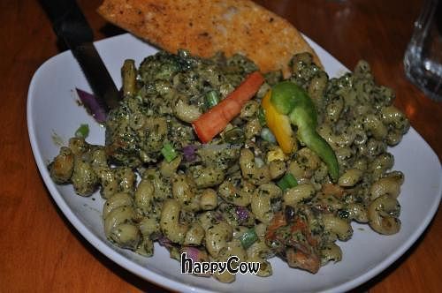 Irie Ites: Tofu sauteed with white wine, garden fresh vegetables, in a creamy dairy free basil pesto. Tossed with cavatappi pasta & spring onions. at Nine Mile Montford in Asheville