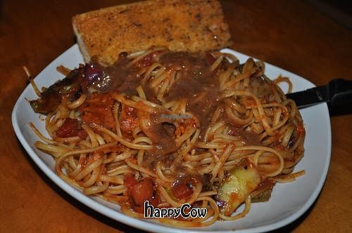 Jamaican Me Thirsty: Jerk tofu with fire roasted tomatoes & garden fresh vegetables, sauteed with white wine & jerk marinara sauce over linguine. at Nine Mile Montford in Asheville