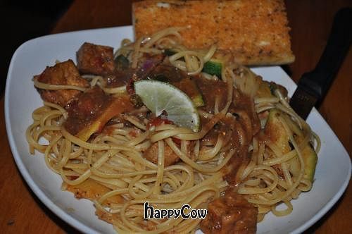 Nine Mile: Jerk tofu with fresh ginger, fire roasted tomatoes, jalapeño peppers, squash, & zucchini, sauteed with white wine & butter over linguine. at Nine Mile Montford in Asheville