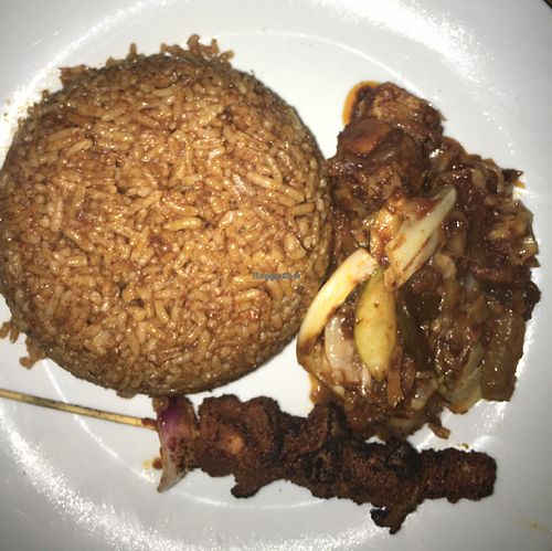 Jollof rice with curried vegetables and soya kebab at The Rising Phoenix in Accra