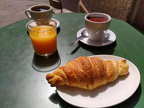 Croissant, hot chocolate and orange juice at The Vegan Corner in Barcelona