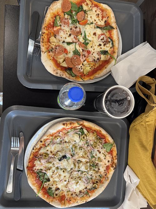 Vegan pizza special and one made with our choice of toppings.  at Pizzeria Bros in Montreal