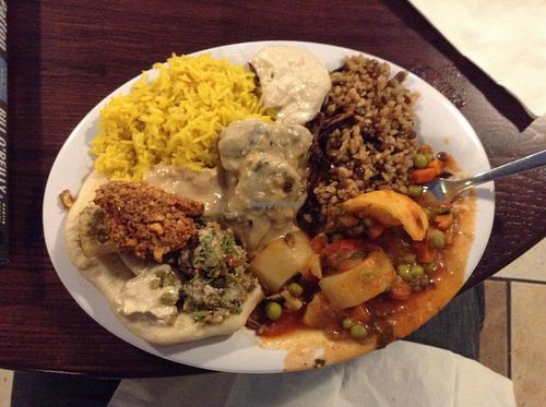 Buffet selections.  The dark brown things in the light brown sauce are eggpant.  at Sanaa's 8th St. Gourmet in Sioux Falls