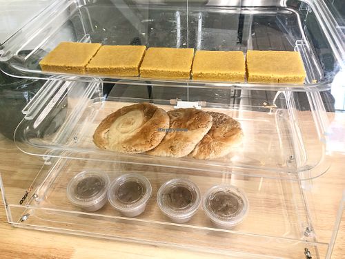 Dessert Case: Turmeric cake, Tahini bread, Spiced bread pudding. at Vegiterranean Kitchen in Moorpark