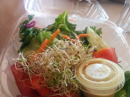 Tasty garden salad, topped with sprouts, housemade dressing. at Soul Vegetarian - South in Atlanta