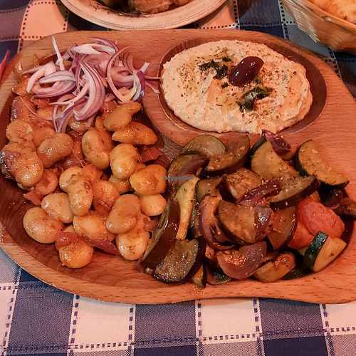 Giant beans in tomato sauce, roasted mix veg, hummus and pita bread. at Adria in Szentendre