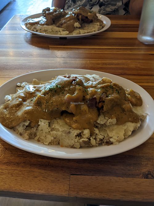 Smothered Chicken, so good! at TRI Lounge & Cafe in Staten Island