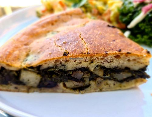 Super soft and tasty focaccia stuffed with spinach, potatoes, kalamata olives, melty cheeze sauce and red onions. at Olivia's Pantry in Kyneton