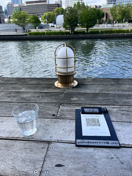 If you sit outside you have to order on your phone   at Optimus Cafe in Osaka