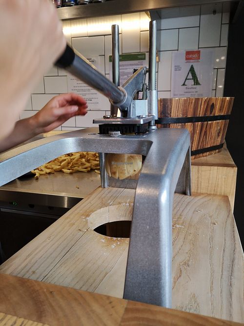 Staff hand making the fries at Double Dutch Fries x Wise Boys Burgers in Takapuna