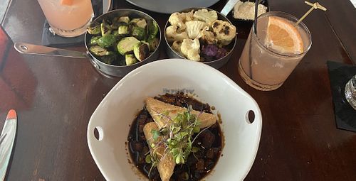 Sichuan Eggplant and Tofu, Caramelized Brussels sprouts in lemon oil, Roasted Cauliflower with capers and a Key West Sunset cocktail!  at Nine One Five in Key West