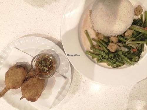 Chicken wings... And kale with fake meat. at Sook Sathorn - Silom in Bangkok