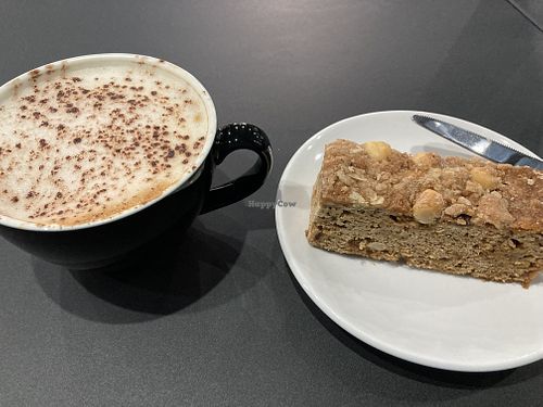 Apple cake and oat milk cappuccino. at The Quirk Space in Olney
