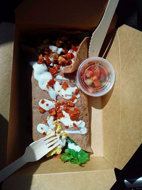 Breakfast burrito to go: messy but delicious. at Portia's Diner in Clintonville