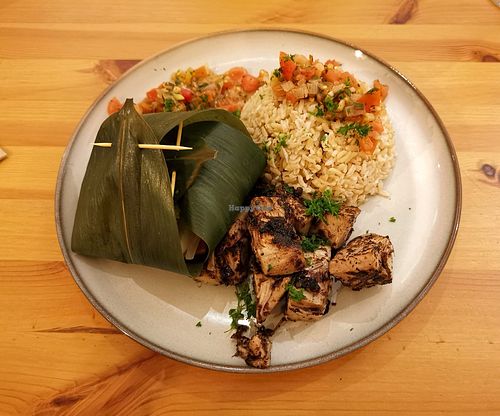 Jackfruit 'fush' fillets with miso paste, steamed vegetables in bamboo leaves, and rice with a tomato salsa at Ventre Content in Liege