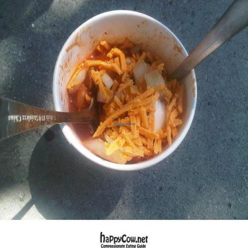 Italian sausage dog topped with sauerkraut and mustard at City Dogs - Food Cart in Salt Lake City