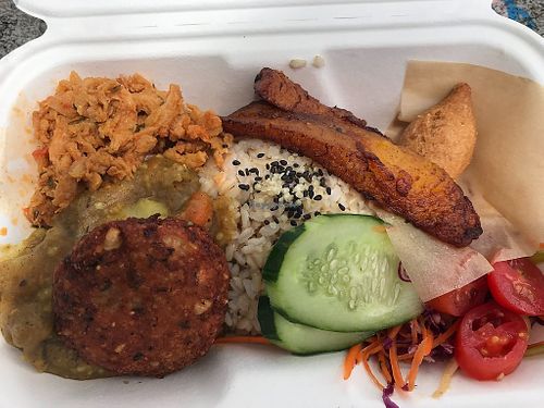 Combo plate with soy protein, black eyed pea fritter, and stew. Sides were plantains, rice, and salad at Roots Time vegan wagon in Hilo