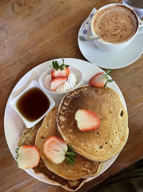 Vegan pancakes with vegan whipped creme. ‘Aztec latte’ with coconut milk.  at De Gustibus Bakery in Puerto Viejo De Talamanca
