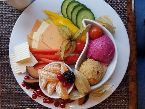 Vegan chees slices, houmous with herbs and beetroot houmous, vegan butter, peaches, mandarin, red currents, blackberries, red/yellow peppers, cherry toms, african ground cherries  at SORAT Hotel in Berlin