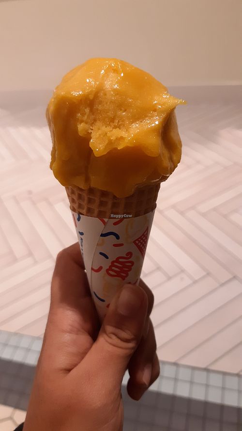 Mango ice cream in a sugar cone at Ample Hills Creamery in Orlando