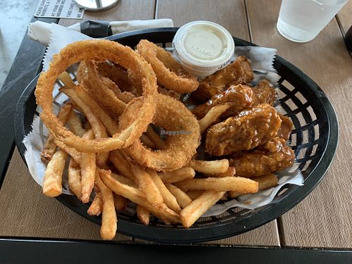 Vegan boneless wings with fries and onion rings  at Korny Vibes in Houston