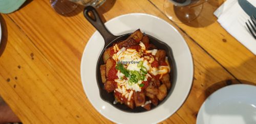 Patatas bravas with vegan cheese at Driftwood Cafe in Ocean Grove