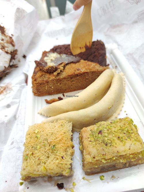 Cakes, almond empanadas,  sweet filo pastries at Nujaila in Granada