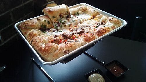 Pizza: half veggie deluxe, half jalapeno. at 4th & State in Columbus