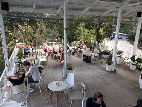 Outside seating area at What's Cup! in Koh Phangan