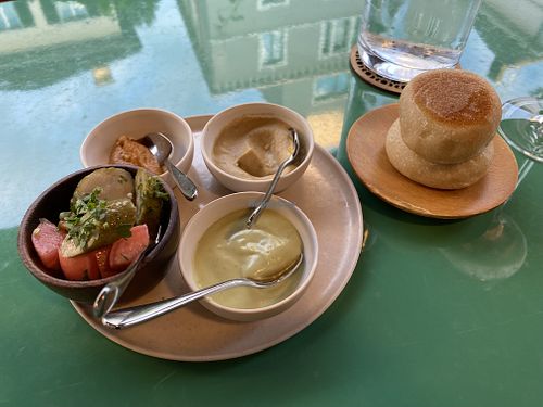 Pillow bread with vegan Mayo, hummus, red tomato pesto, and spiced pickles.  at KLE in Zurich