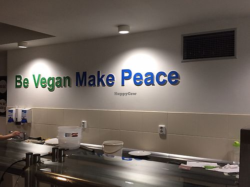 behind the counter at Loving Hut - Na Porici in Prague