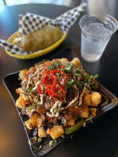 Tachos with BBQ Jackfruit option and a vegan burrito in the background at The Good Bar in Long Beach