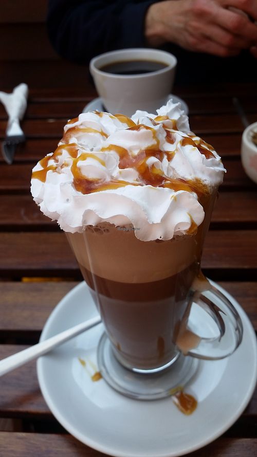 Deluxe hot choc with vegan whipped cream and syrup of your choice at TeaCups in Romsey