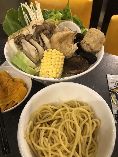 Variety of ingredients. Pumpkin ramen noodles in the foreground at Arashi Shabu-Shabu in Johor Bahru
