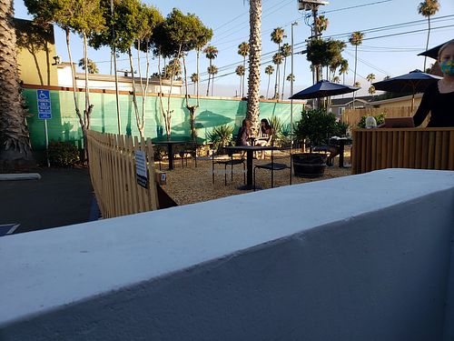 Outdoor parking lot conversation for virus season. at The Plot in Oceanside