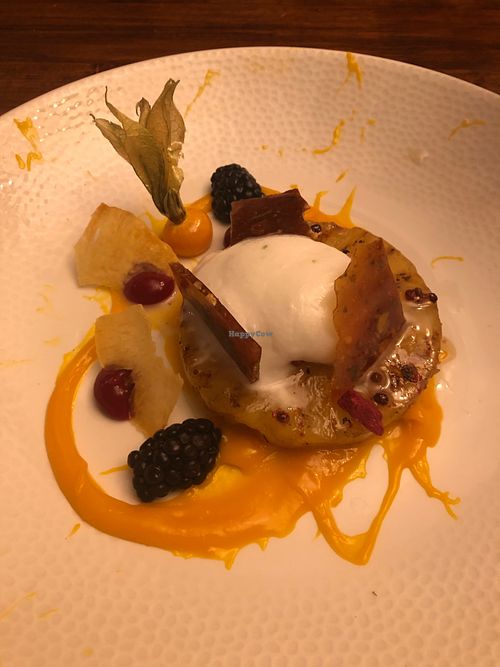 Pineapple with coconut ice cream, mango puree, berries, caramel and pink peppercorns  at The Angel Inn in Colchester