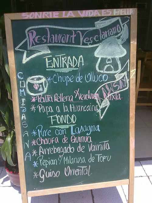 Menu board outside at La Casita de Kawsay in Lima
