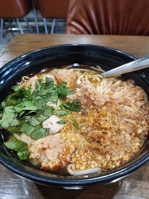 Tom Yum with mock pork and mushroom ball at Veganerie - Nana in Bangkok