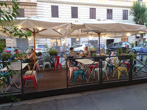 Outdoor seating at Flower Burger in Rome
