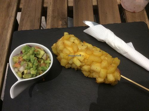 The hot dog in French fries special with a guacamole side. at Savannah Snack Bar in Belgrade