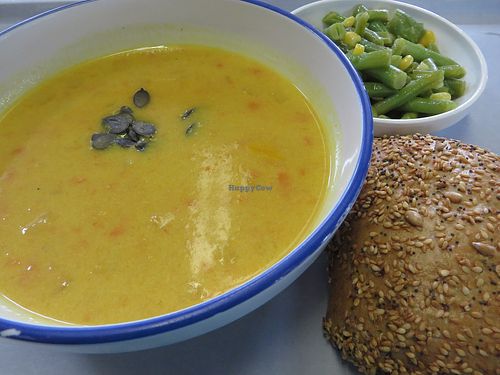 Mango and pumpkin soup accompanied by a salad and a wholemeal breadroll (vegan) at Mensa in Saarbrucken