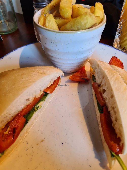 Hummus, roast pepper and spinach roll with chips at Wighton in Torquay