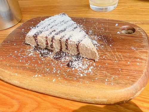 Chia pudding with chocolate sauce and coconut flakes  at 2084 in Kowloon