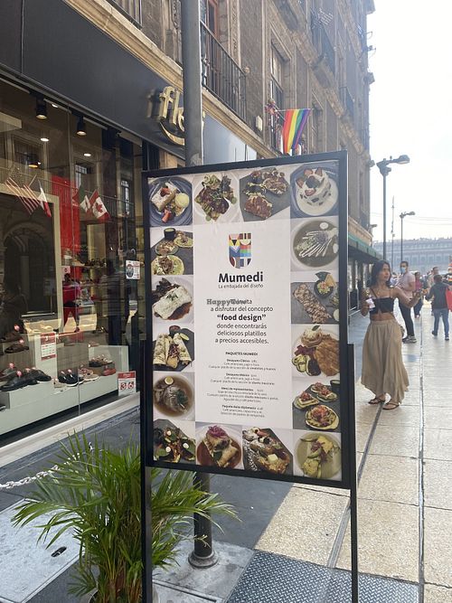 Mumedi Outdoor Sign w/Zócalo in Background  at Mumedi in Mexico City
