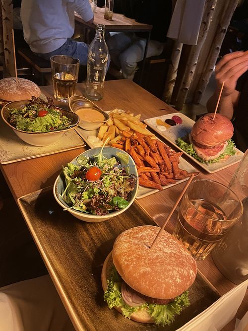 Mixed fries, “naturbursche” burger, side salad  at Hans im Glück in Basel