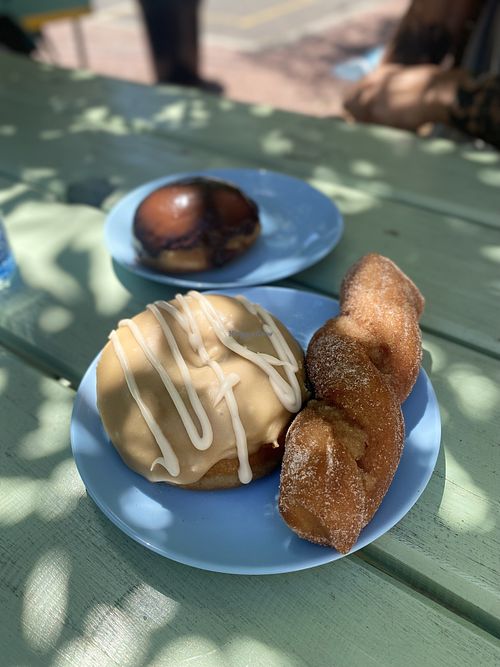 Maple coffee donut plus chocolate with custard   at Grumpy & Runt in Western Cape