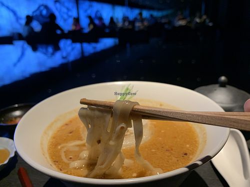 Spicy miso ramen (with thick onion slices on top) at Vegan Ramen UZU Kyoto in Kyoto